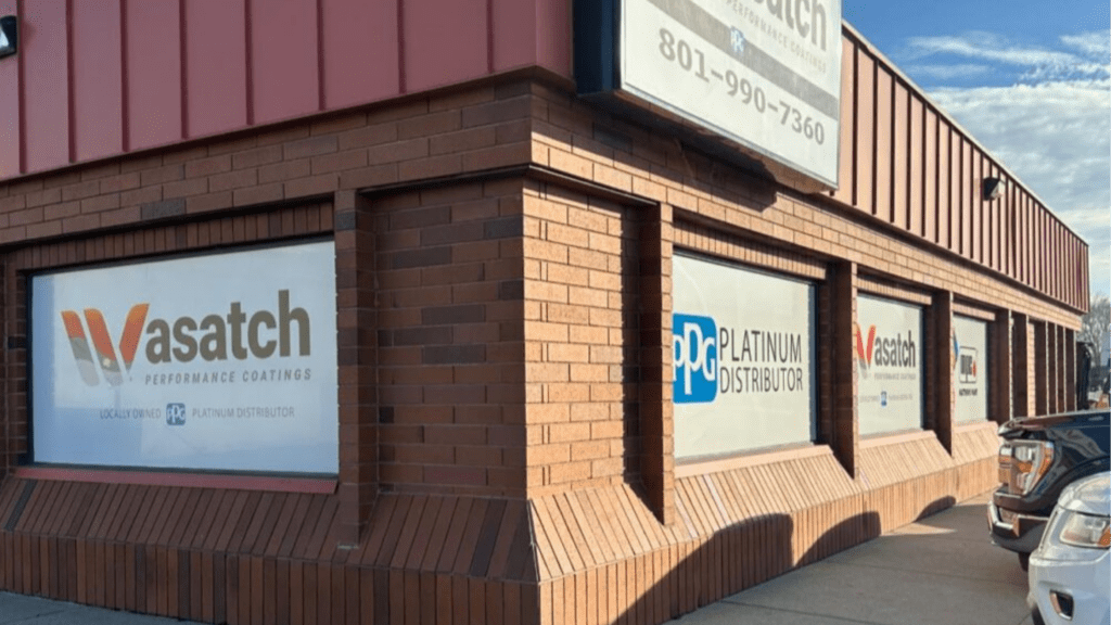 Storefront with professionally installed perforated window graphics showing exterior branding